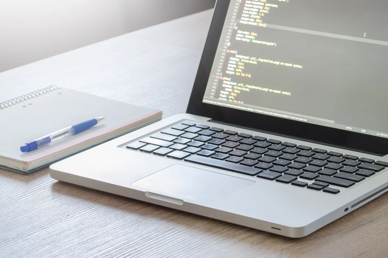 Web developer building a business website on a laptop